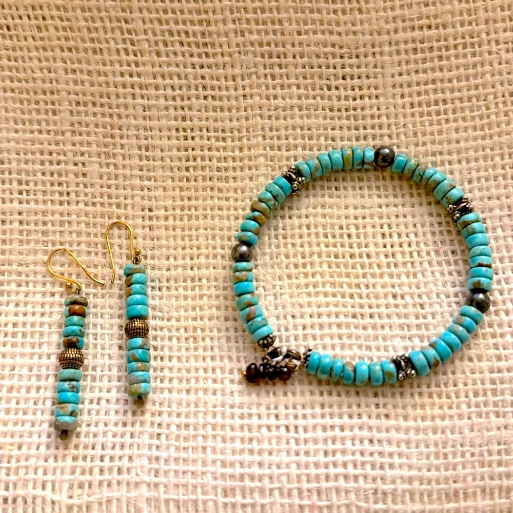 One of a kind, African turquoise beads w/sterling & brass beads. 14k gold post.